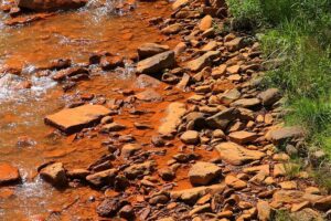 Rocks stained by acid mine drainage on Shamokin…